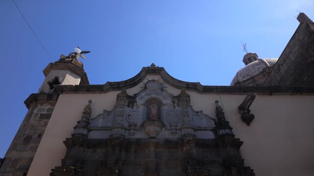 View of an ornate historic church facade in Ciudad Guzman, Jalisco, Mexico, ideal for travel, architecture, and cultural destination content.