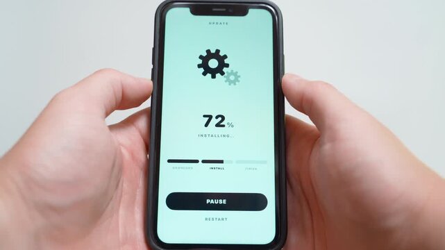 Software update installing on smartphone screen with progress percentage and gear icons