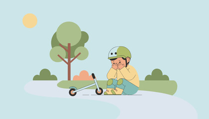 Fototapeta premium Sad little child wearing a helmet and knee pads sits crying on a park path after falling off a kick scooter.
