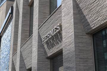 Fototapeta premium exterior building facade and sign of Hermès, a fashion accessories store, located at 100 Bloor St W (inside 10 Bellair Condominium), Toronto