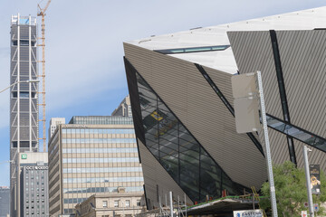 Fototapeta premium looking east on Bloor St W with view of Royal Ontario Museum, office/commercial buildings and One Bloor West, Toronto