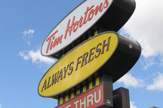 classic shaped Tim Hortons road side pylon sign at 1900 O'Conner Dr (northwest corner at Victoria Park), Toronto