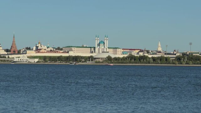 Calm, still water&mdash;free of waves and wind&mdash;on a summer day in Kazan; the Kul Sharif Mosque and the Kazan Kremlin are visible on the opposite bank.
