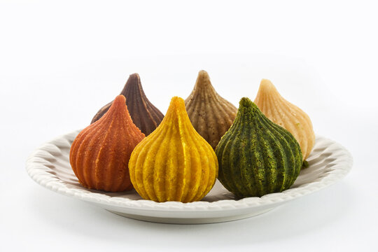 Colorful modak sweets on plate for ganesh chaturthi