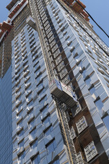 Obraz premium skyward view of Forma Toronto, a condominium complex designed by Frank Gehry, under construction at 266 King St W & Ed Mirvish Way / Duncan St