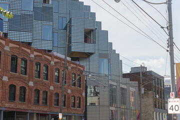 Obraz premium wide perspective view of exterior of KING Toronto Condos designed by Bjarke Ingels Group (BIG) in the area of King W and Portland