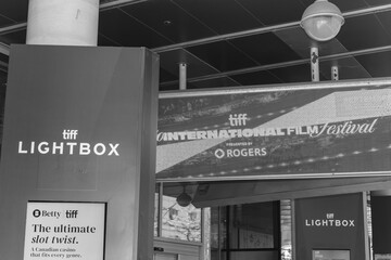 Obraz premium black and white exterior view of signage at TIFF Lightbox, a movie theatre, located at 350 King St W, Floor 1 of the Festival Tower, Toronto