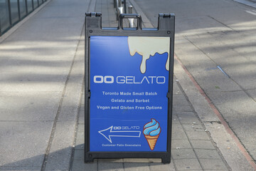 Obraz premium sidewalk a-frame sign outside Oogelato, an ice cream shop, located at 370 King St W, Floor 1 of the Hyatt Regency Toronto
