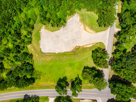 Top down aerial view of a cleared land site for new development with construction site urban planning land plot vacant land green space property development real estate site preparation