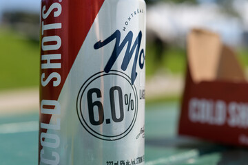 Obraz premium macro of an isolated Molson Cold Shots Lager can on a picnic table in Toronto