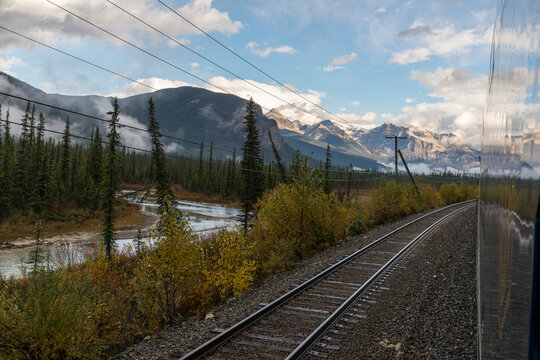 Canada, Alberta, Banff National Park.  View of railway tracks beside the Bow River. 