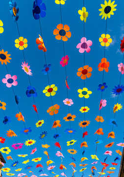 France, Dordogne, Sarlat-la-Can&eacute;da.  Decorative flowers strung above the main road in this market town.