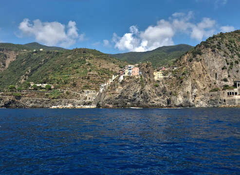 scenic view from the sea of ​​the rocky Ligurian coast of Corniglia
