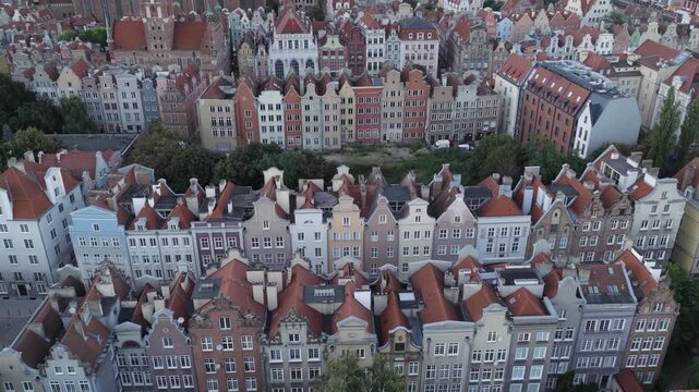Aerial view of colorful historic townhouses with red tiled roofs in the old town of Gdansk, Pomeranian Voivodeship, Poland.