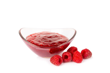 A jar of raspberry jam isolated on white background. A bowl of sweet berry jam. fruit spread texture, red jam splatter, organic dessert topping. clipping path © Avocado_studio