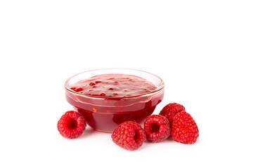 A jar of raspberry jam isolated on white background. A bowl of sweet berry jam. fruit spread texture, red jam splatter, organic dessert topping. clipping path © Avocado_studio