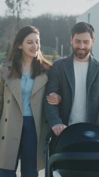 Smiling pair in city park, Cheerful duo peacefully promenades through park under gentle morning sunlight