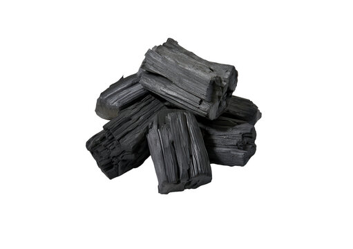 Natural black charcoal chunks piled together for barbecue fuel and industrial energy use.