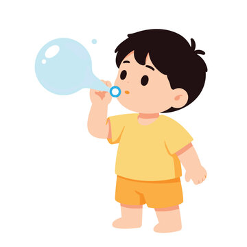 A young boy with dark hair wears a yellow t-shirt and shorts while blowing a bubble.