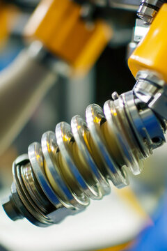 Close-up shot of a hose connected to a machine. vertical frame
