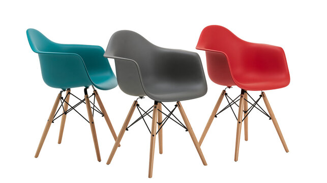 Isolated modern colorful plastic armchairs with wooden legs contemporary design furniture studio shot