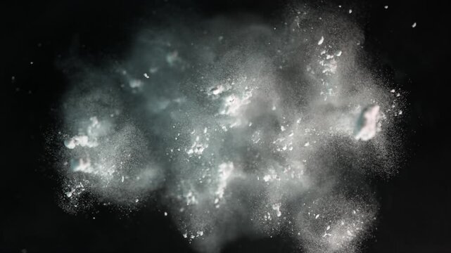 Super Slow Motion Shot of Exploded White Powder on Black Background at 1000 fps.