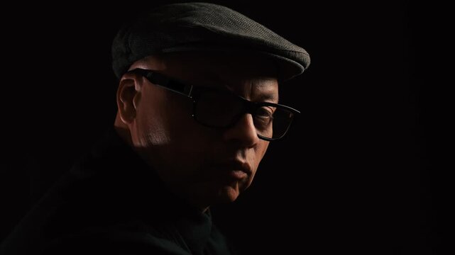 Black man gives side glance to camera
