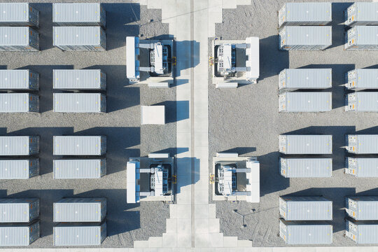 Aerial view of battery energy storage system facility for renewable power plant. Industrial lithium batteries used for clean electricity grid management.