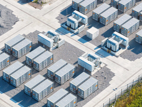 Aerial view of battery energy storage system facility for renewable power plant. Industrial lithium batteries used for clean electricity grid management.