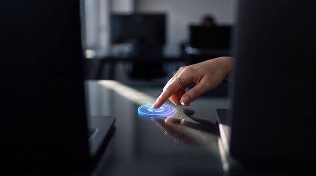Asian Female Hand Tapping Glowing Token Icon in Dark Office for Cybersecurity Social Media Background