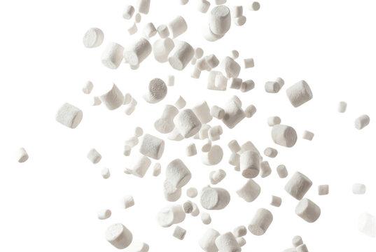 Falling white marshmallows floating against a solid black background