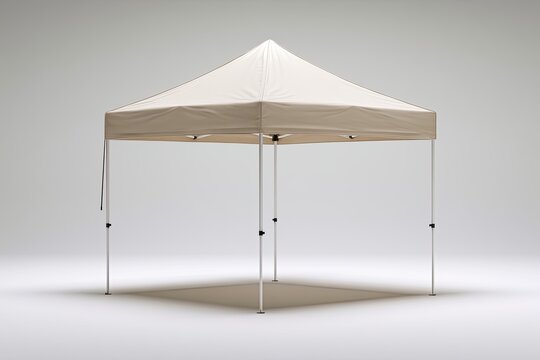 A white four-legged canopy tent stands on a grey, circular background