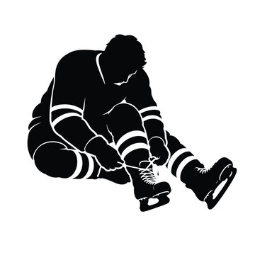 Person sitting and tying ice skates, preparing for winter sports, skating practice and athletic recreation in a bold black silhouette