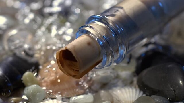 Slow motion of a bottle pouring into water