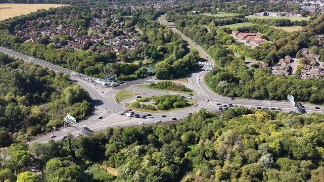 Drone Aerial Footage of Busy Roundabout Traffic in Basingstoke UK Road Infrastructure