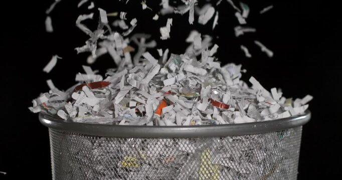 Shredded paper flying in slow motion