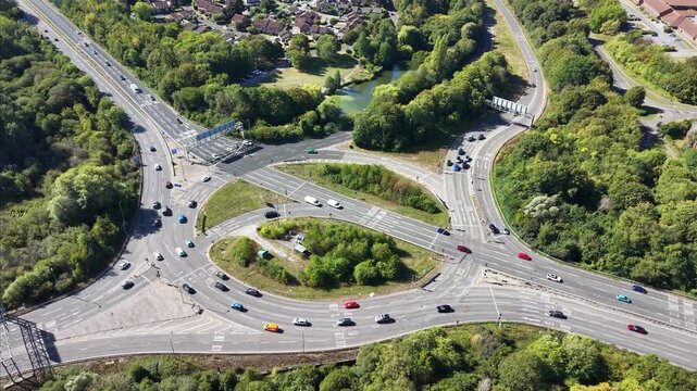 Drone Aerial Footage of Busy Roundabout Traffic in Basingstoke UK Road Infrastructure