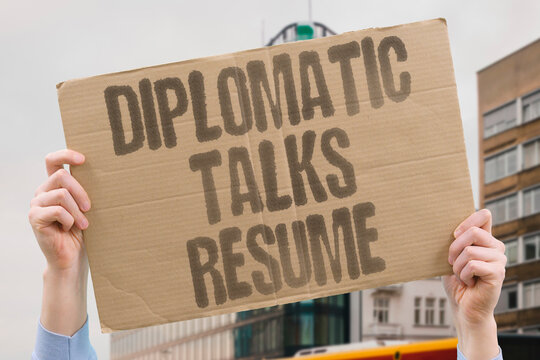 "Diplomatic talks resume" Negotiators reconvene discussion toward resolving trade dispute. DIPLOMACY. NEGOTIATION. TRADE. TALKS.