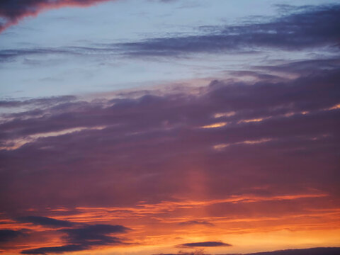Vibrant sunset sky with orange and purple clouds