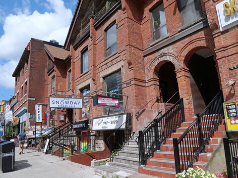Church Street in Toronto, a lively commercial area of a gay neighborhood, with old houses converted into stores