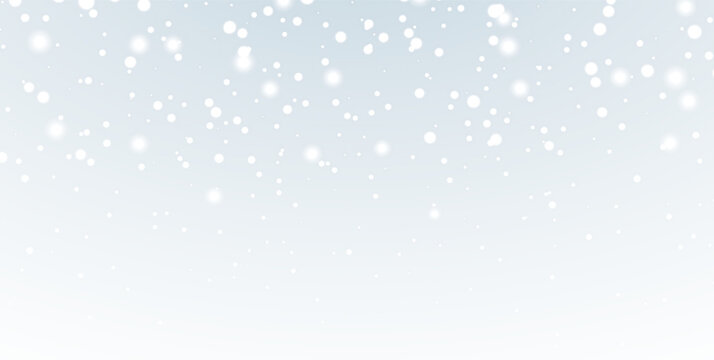 Light winter snowfall with shimmering snowflakes, soft white particles and gentle snowfall on pale grey background.