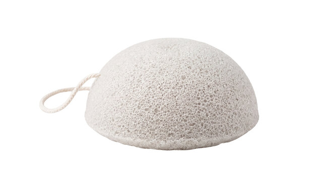 Natural konjac sponge for facial cleansing, white porous exfoliating sponge, organic skincare tool for gentle face washing and beauty routines isolated PNG with Transparent Background