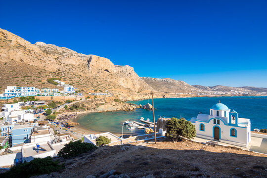 View of sea bay with beautiful beach and traditional church on Karpathos island in Foiniki village, Greece