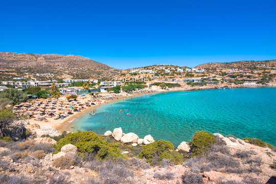 View of sea bay with beautiful beach and traditional church on Karpathos island in Ammopi village, Greece