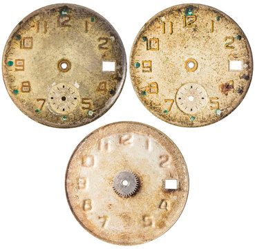 Isolated photo of beige colored vintage worn clock or watch face on white background.