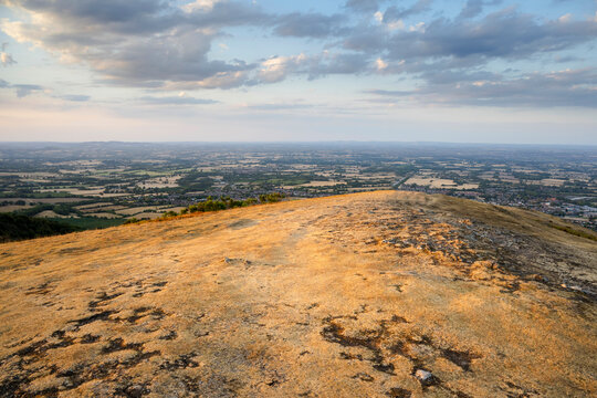 View of sun baked Worcestershire Beacon at sunset,atop the Malvern Hills,Worcestershire,England,UK.