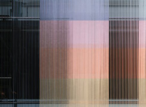 Abstract textile with vertical lines and soft pastel color blocks