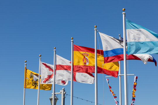 historic flag flutterin in the wind, the flags are from historic periods in california
