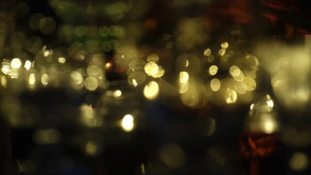 Festive abstract night background with glowing holiday lights and elegant bokeh. Magic of a celebration, twinkling fairy lights, decorative garlands, soft refraction of light through glassware, champa