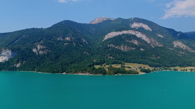 Alp lake in scenic nature. Scenic nature alp hiking lake. Wilderness and adventure at forest with lake. Alp green landscape. Landscape of idyllic forest at lake. Mountain ridge. Nature alp landscape